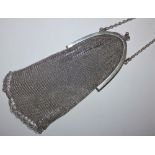 A silver mesh purse, London 19245, with arched top and chain