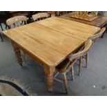 A pine kitchen table with turned legs, 120 x 106 cm together with four turned chairs (5)