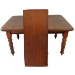 A Victorian mahogany wind out dining table, with thumb nail edge, raised on four carve and fluted