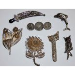 A silver owl brooch, a similar dolphin brooch, various silver filigree brooches and a Chinese silver