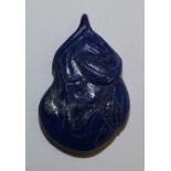 A Chinese carved lapis lazuli matrix pendant, in the form of a gourd, length 40 mm.