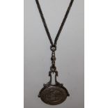 A silver long chain with swivel fob seal