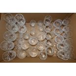 A collection of crystal drinking glasses including whisky, wine, sherry, etc