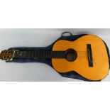 A Tatra Classic Czechoslovakia made acoustic guitar, with interior label and woven strap, in a