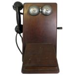 A dark mahogany cased wall telephone, marked "N2516J6T" to the reverse and "TEL Beeston Notts