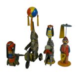 Four early clockwork tinplate toys including a ball holding performing elephant, marked "Germany