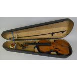 A cased violin with two-piece back and ebony fingerboard, bears label "