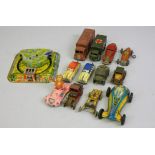 A collection of eight early tinplate toys including a Mettoy clockwork 'Twin Tunnel Trains',