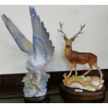 A Spanish model of a mythical bird on plinth together with Royal Doulton model of a stag on wooden