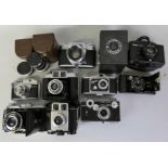 A large collection of vintage cased cameras and accessories, including a c.1910's Eastman Kodak