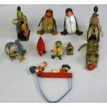 A collection of ten early tinplate toys including a British Wells Brimtoy clockwork drummer,