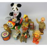 A collection of seven early tinplate toys including a British made lithograph 'Crazy Cowboy' wind-up