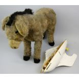 A mid 20th century Chiltern Toys push-along beige mohair donkey, probably 1950's, with label to