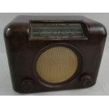 A Bush 'Type DAC 90 A' bakelite radio, in brown, with A.C-D.C. mains receiver, serial No. 73/176712.