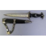 A reproduction SS dagger, with rune and skull hanger, 21.5 cm blade and 38 cm overall in scabbard.