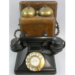 A vintage GPO bakelite telephone, the ebonised receiver with "No. 164" embossed, connected to a