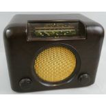 A Bush 'Type DAC 90 A' bakelite radio, in brown, with A.C-D.C. mains receiver, serial No. 73/28804.