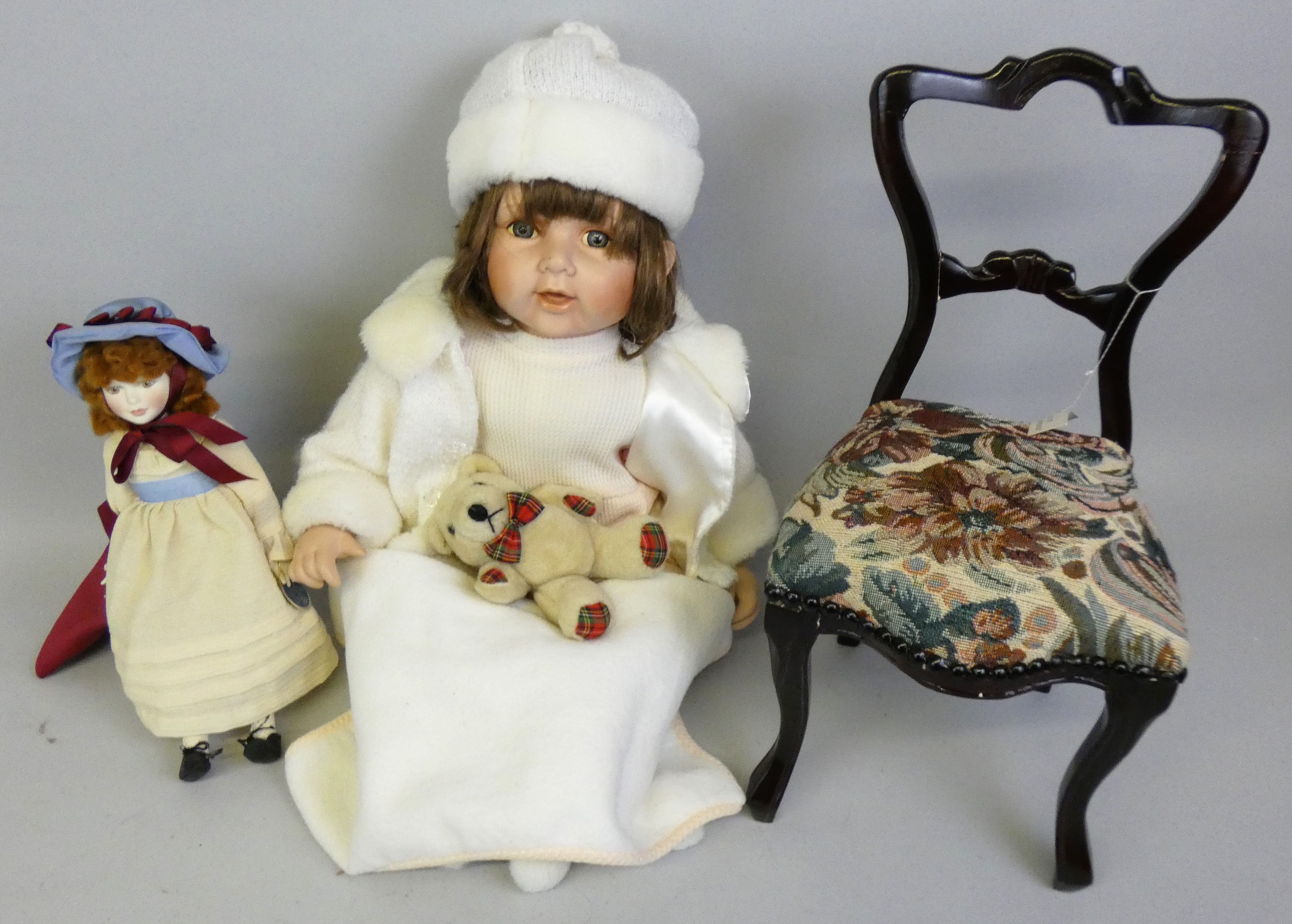 A Royal Doulton Nisbet porcelain limited edition doll "Little Model", No. 3882/5000, together with a
