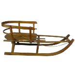 A vintage wooden sledge, total length 120 cm.