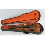 A French cased violin with two-piece back and ebony fingerboard, bears label "