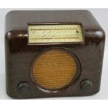 A Bush 'Type DAC 90' bakelite radio, in brown, with A.C-D.C. mains receiver, serial No. 10/33628.