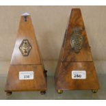 A Victorian walnut cased metronome, London made, together with a similar mahogany cased metronome(