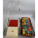A Tri-Ang pressed steel pull-along wagon with building blocks, c. 1950's, together with a Tri-ang