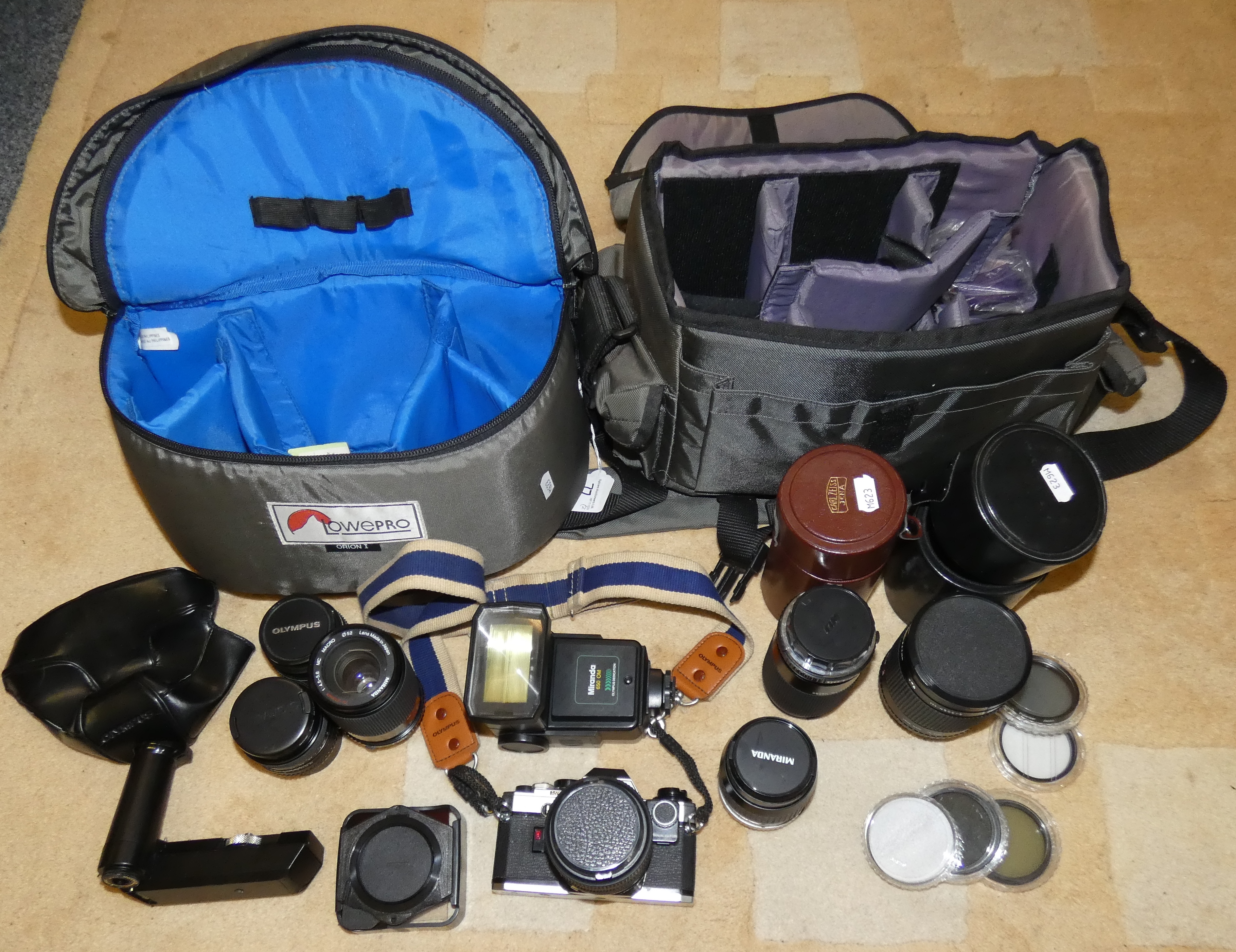 Camera equipment and accessories including Olympus camera OM2, Miranda camera lens, Sigma lens,