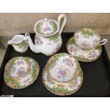 A Shelley Sheraton pattern tea service comprising two milk jugs, two cups and saucers and smaller