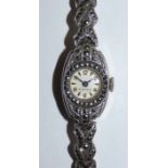 A silver and marcasite ladies manual wind wristwatch London 1960