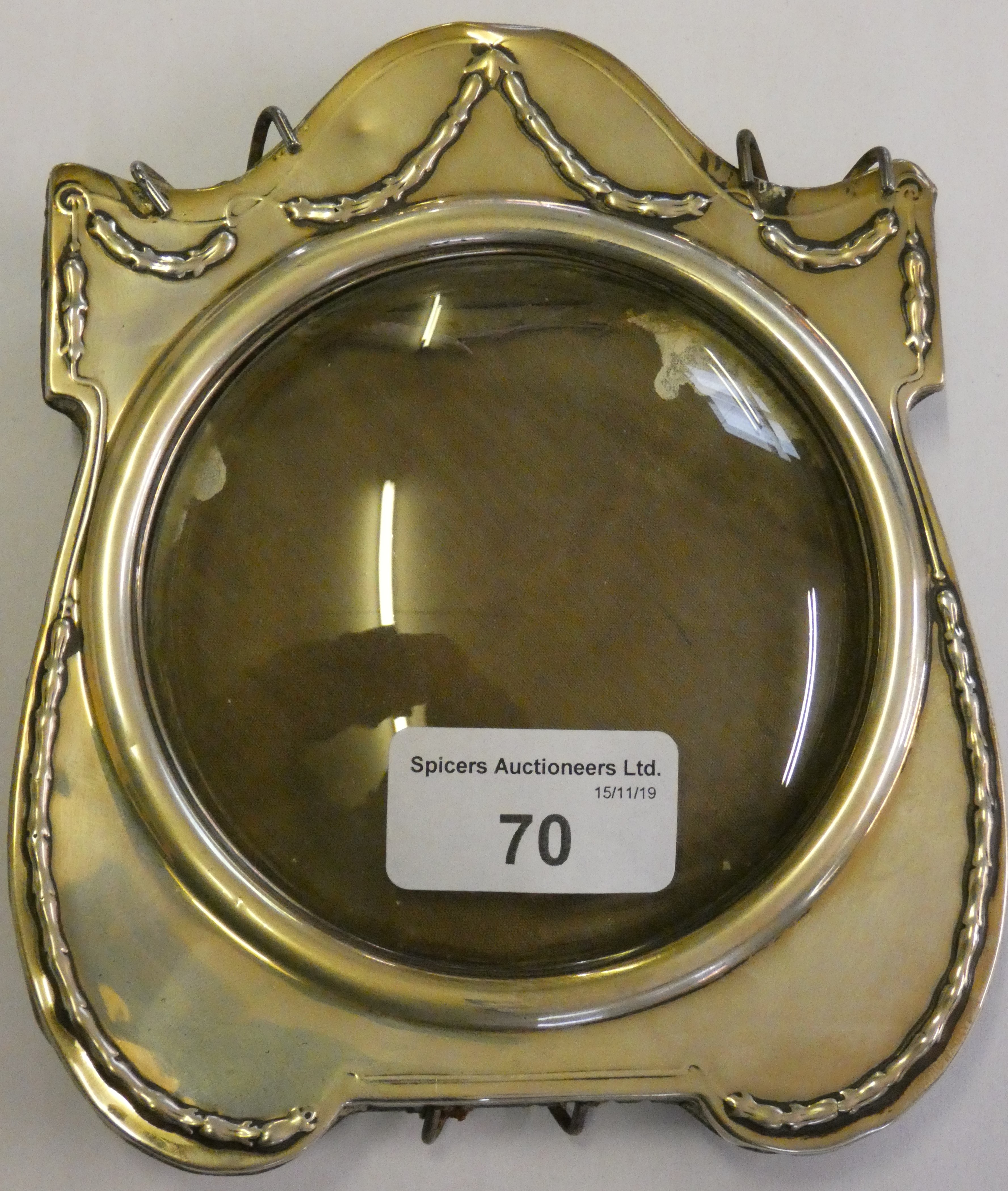 A silver photograph frame, marks worn and lacking strut