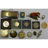 A silver purse Birmingham 1918 with fitted interior, a Chinese jade pendant, a Chinese gilt disc