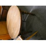 A pair of Victorian pitch pine cricket table, with revolving circular top, 85 cm wide