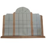An Art Deco arched wall mirror, reverse cut panels with orange panels between, the whole mirror is