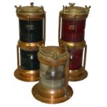 Three copper and brass electric trawler lanterns by Seahorse, a double "not under command" red lamp,