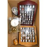 A wall clock, a collection of thimbles in three display cases, loose thimbles, presentation cups and