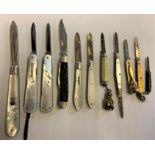 Three silver bladed mother of pearl fruit knives and other pen knives