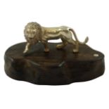 Patrick Mavros, a Zimbabwean silver model of a lion, c.1990, with his initials and Zimbabwean