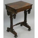 A 19th century rosewood side table, with frieze drawer, lacking slide beneath, to carved and and