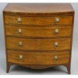 A mahogany bow front chest of four graduated long drawers, with lion mask handles, 79 x 45 x 80 cm.