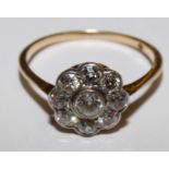 An 18ct gold and diamond cluster ring, collet set with old cut stones, total weight approximately