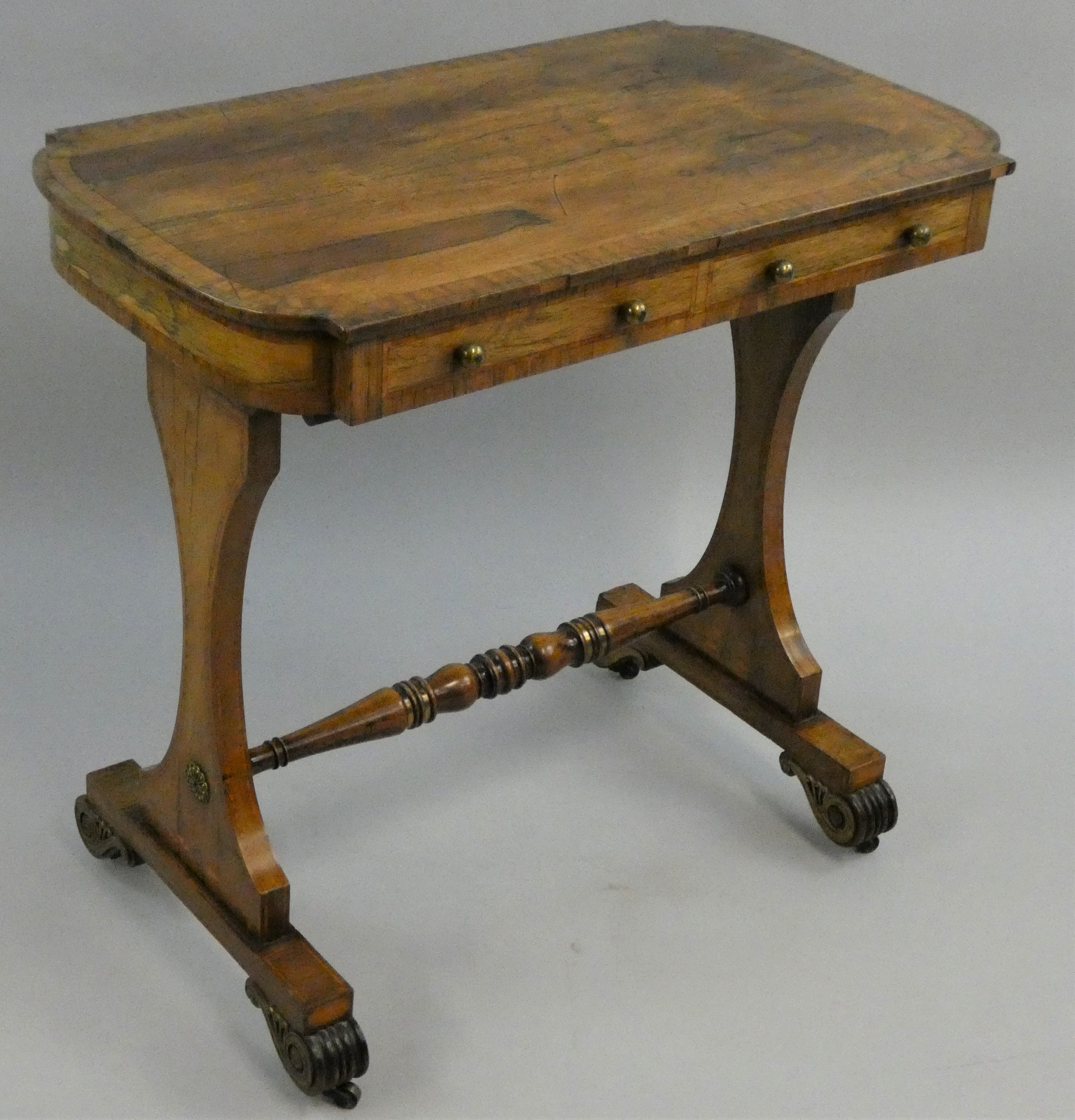 A George III rosewood and boxwood strung side table, with two frieze drawers, lyre shaped supports