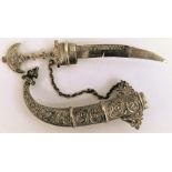 A Middle Eastern silver novelty brooch, in the form of a Khunger, the removable blade with chain