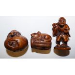 A Japanese carved wood netsuke, in the form of a turtle on an egg, character mark to the