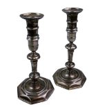 A George II Irish silver pair of cast candlesticks, by John Hamilton, Dublin 1728, triangular