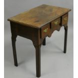 A mahogany side table, with three drawers and shaped apron, 76 x 46 x 69 cm.