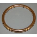 A 9ct rose gold plain hollow slave bangle, Birmingham 1920, diameter 8 mm, inner diameter 75 mm,