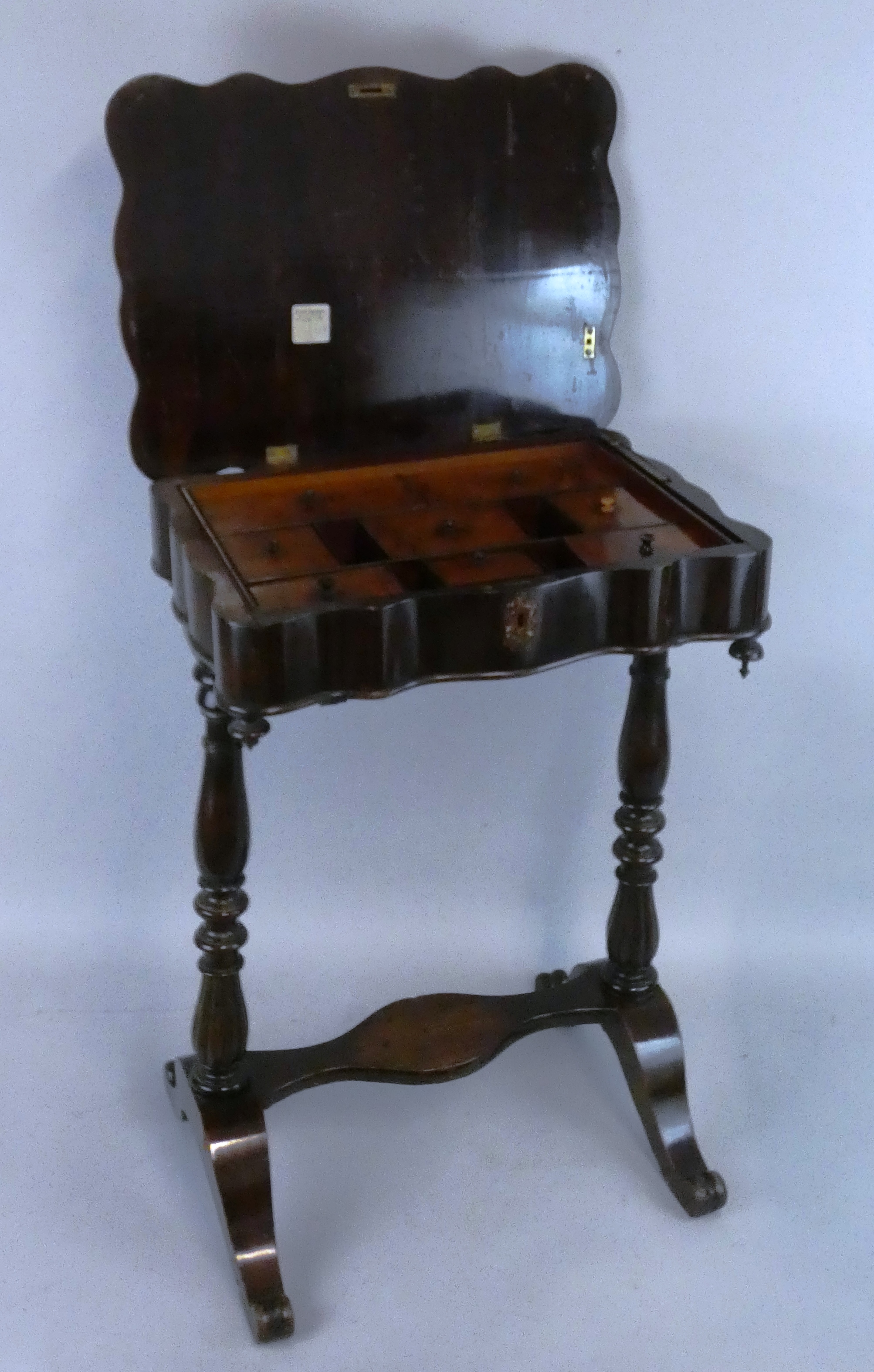 A Victorian mahogany work table, the shaped top opening to reveal a fitted interior with lidded - Image 2 of 2