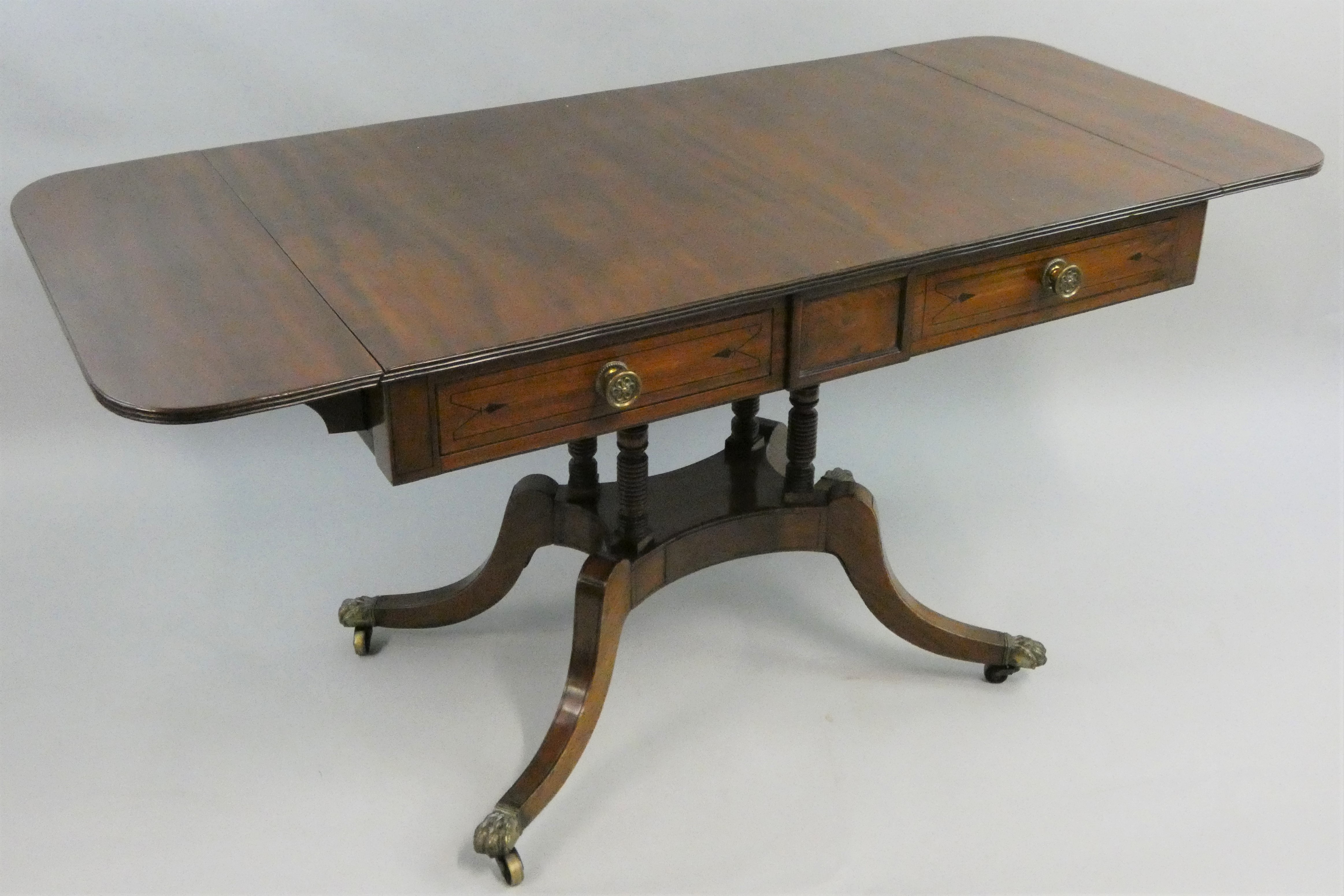 A 19th century mahogany and ebony strung sofa table, with two unequal length frieze drawers,