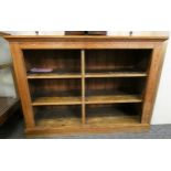 A pine open cupboard with two shelves and a central divider, formerly from a local school.